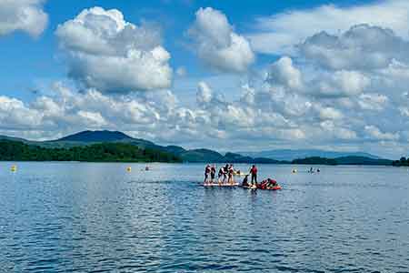 Standup paddleboard, kayaking and other watersports in picturesque town of Luss beside Loch Lomond