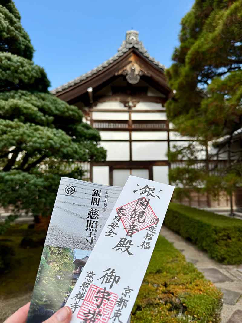 Japanese temple entry tickets and calligraphy representing a spiritual journey and the transition of seasons